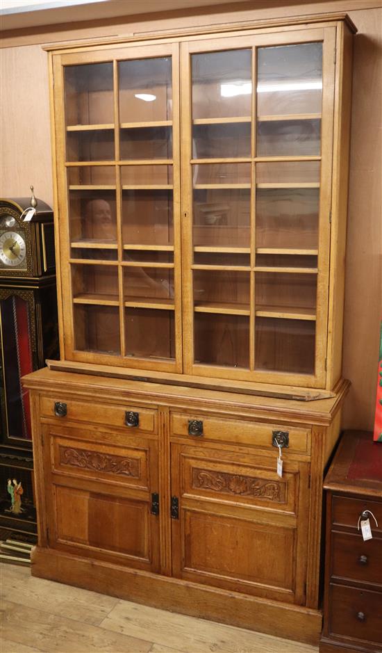 A Victorian oak bookcase cabinet W.137cm